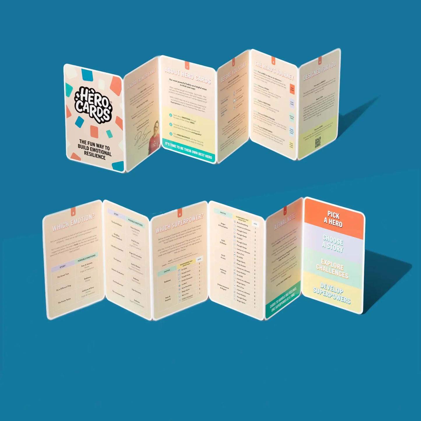 Example of Hero Cards' instructions - folded cards with colorful designs and text on a blue background